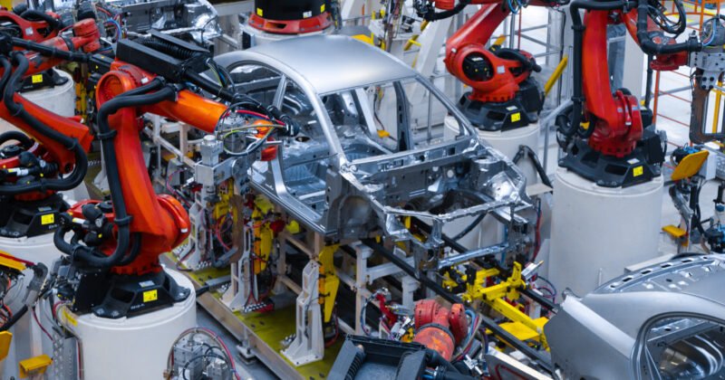 Automotive production line. Welding car body. Modern car Assembly plant
